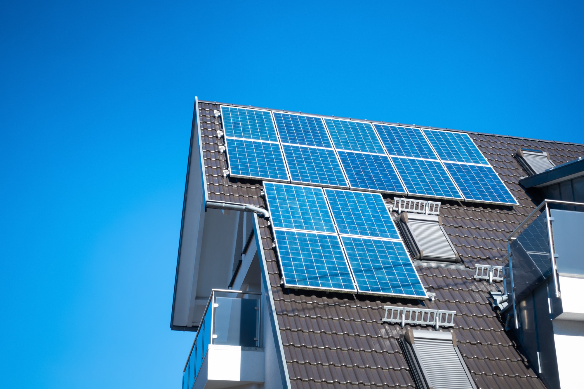 some solar panels on the roof of a private house